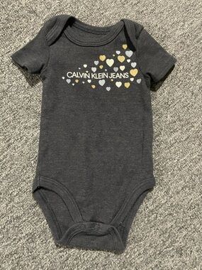 Calvin Klein Jeans Black Infant Bodysuit with Metallic Heart Accents